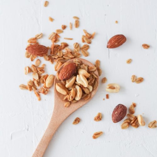 brown wooden spoon with brown and white seeds