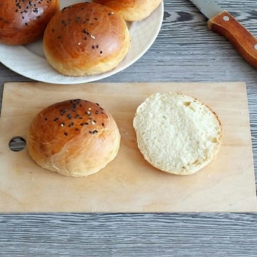 three brown bread on brown wooden chopping board